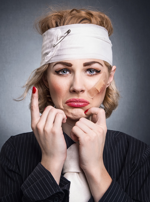 Funny woman with diaper head showing pain and crying